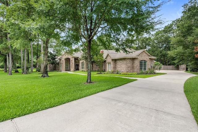 3207 W Benders Landing Blvd, Spring, TX 77386 - view of front of house with concrete driveway and brick siding
