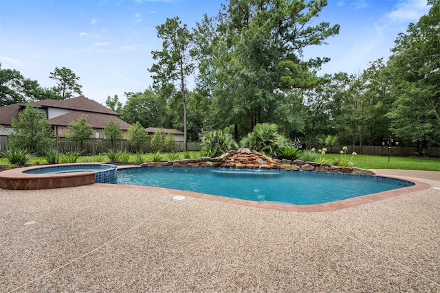 3207 W Benders Landing Blvd, Spring, TX 77386 - view of swimming pool with a pool with connected hot tub, view of scattered trees, and a patio area