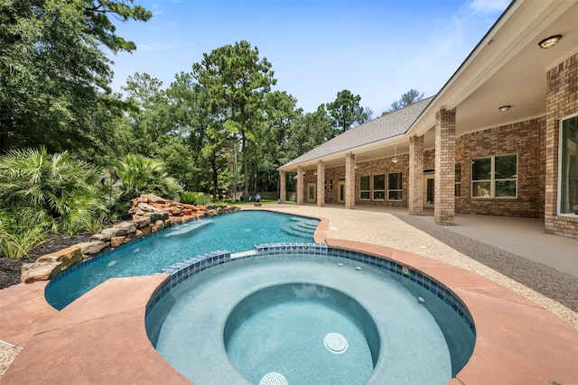 3207 W Benders Landing Blvd, Spring, TX 77386 - view of pool with a pool with connected hot tub and a patio area