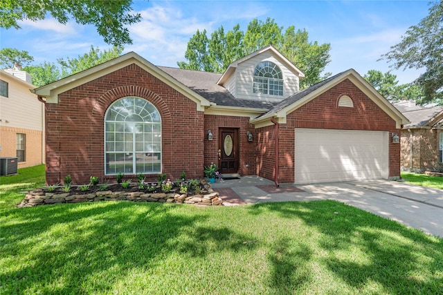 15207 Hillside Park Way, Cypress, TX 77433 - view of front of home featuring brick siding, an attached garage, a front lawn, and driveway