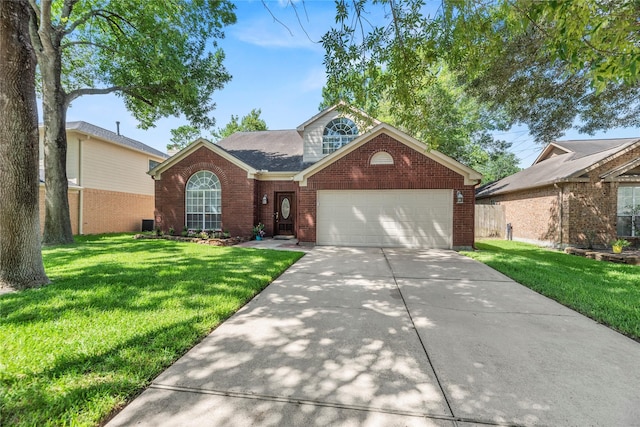 15207 Hillside Park Way, Cypress, TX 77433 - traditional-style home featuring brick siding, a garage, a front yard, and driveway
