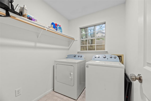 15207 Hillside Park Way, Cypress, TX 77433 - laundry area with independent washer and dryer and light tile patterned floors