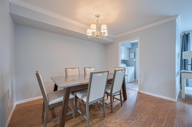 14666 Perthshire Rd Unit F, Houston, TX 77079 - dining area with a chandelier, independent washer and dryer, wood finished floors, and crown molding