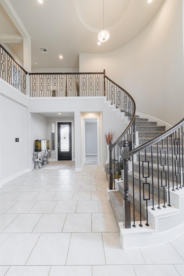 3514 Hampton Landing Ct, Katy, TX 77494 - tiled entryway featuring a towering ceiling, stairs, and recessed lighting