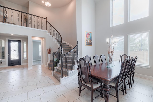 3514 Hampton Landing Ct, Katy, TX 77494 - dining space with a towering ceiling, stairway, a chandelier, and light tile patterned flooring