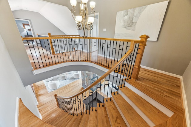 1851 Harold St, Houston, TX 77098 - stairs featuring wood finished floors, a chandelier, and lofted ceiling