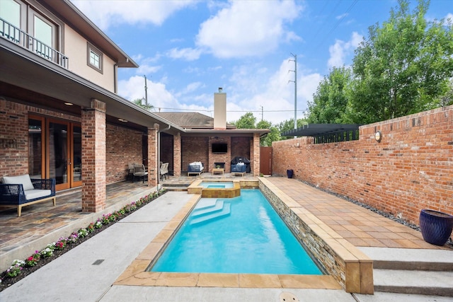 1851 Harold St, Houston, TX 77098 - view of swimming pool with a patio area, a pool with connected hot tub, and grilling area