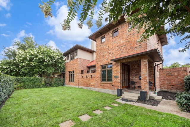 1851 Harold St, Houston, TX 77098 - rear view of house with brick siding and a fenced backyard