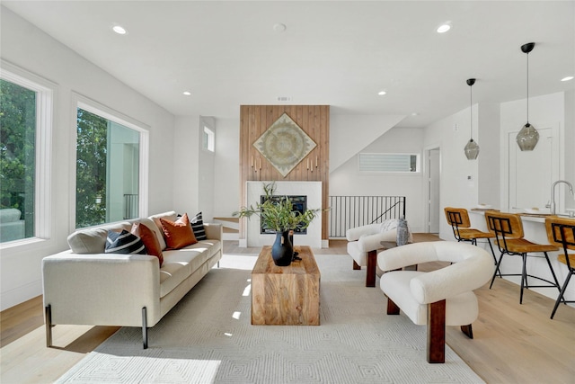 5439 Darling St, Houston, TX 77007 - living area with light wood-style floors, recessed lighting, and a fireplace
