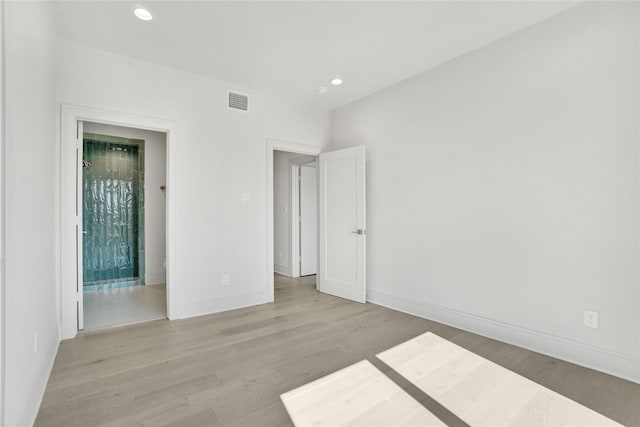 5439 Darling St, Houston, TX 77007 - empty room with light wood-style floors and recessed lighting