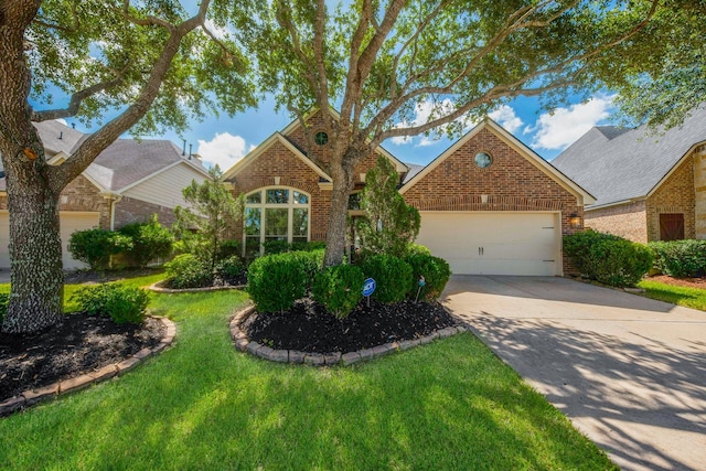 27907 Brandy Creek Ln, Fulshear, TX 77441 - view of front of home featuring brick siding, driveway, an attached garage, and a front yard
