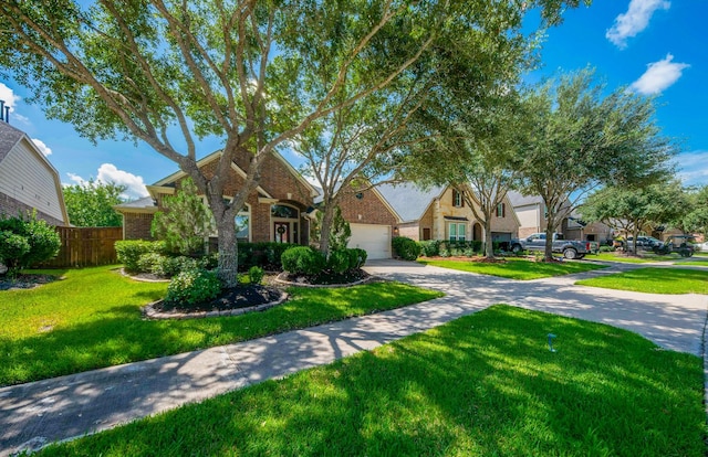 27907 Brandy Creek Ln, Fulshear, TX 77441 - view of front facade with brick siding, concrete driveway, and a garage