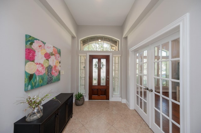 27907 Brandy Creek Ln, Fulshear, TX 77441 - entryway featuring french doors, light tile patterned floors, and plenty of natural light