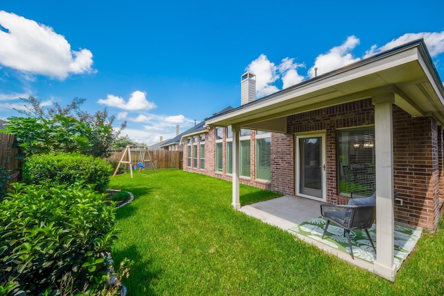 27907 Brandy Creek Ln, Fulshear, TX 77441 - fenced backyard with a playground and a patio area