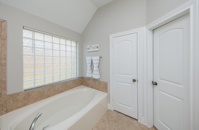 27907 Brandy Creek Ln, Fulshear, TX 77441 - bathroom with a bath, lofted ceiling, and tile patterned floors
