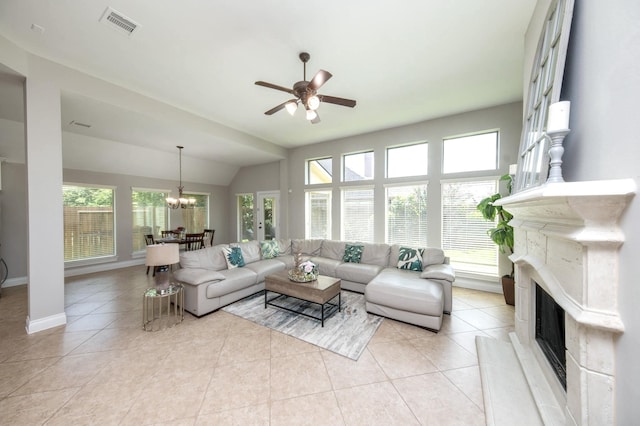 27907 Brandy Creek Ln, Fulshear, TX 77441 - living room with a fireplace, a chandelier, healthy amount of natural light, ceiling fan, and vaulted ceiling