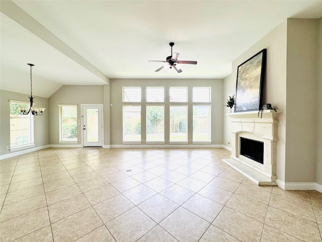 27907 Brandy Creek Ln, Fulshear, TX 77441 - unfurnished living room with light tile patterned floors, ceiling fan, a fireplace with raised hearth, a chandelier, and lofted ceiling