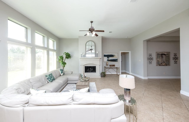 27907 Brandy Creek Ln, Fulshear, TX 77441 - tiled living room featuring a ceiling fan and a fireplace