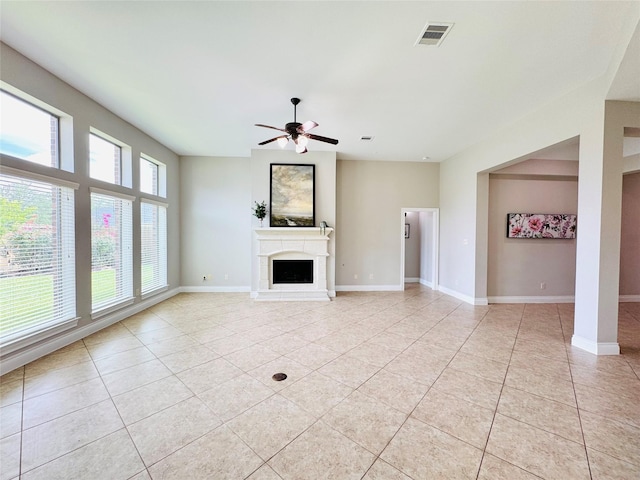 27907 Brandy Creek Ln, Fulshear, TX 77441 - unfurnished living room featuring light tile patterned flooring, a ceiling fan, and a fireplace