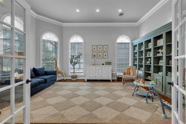 8723 Kennet Valley Rd, Spring, TX 77379 - sitting room with ornamental molding, french doors, recessed lighting, and wood finished floors