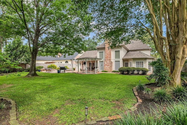 8723 Kennet Valley Rd, Spring, TX 77379 - back of property with a patio and a shingled roof