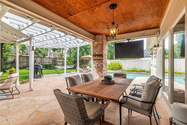 8723 Kennet Valley Rd, Spring, TX 77379 - fenced backyard with a pergola, a patio area, area for grilling, and outdoor dining area