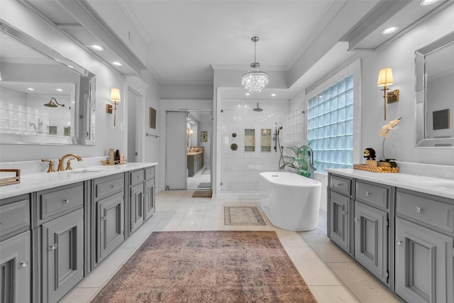 8723 Kennet Valley Rd, Spring, TX 77379 - bathroom with a stall shower, vanity, tile patterned floors, a freestanding bath, and a chandelier
