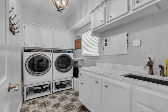 8723 Kennet Valley Rd, Spring, TX 77379 - laundry area with cabinet space, washing machine and dryer, and a chandelier