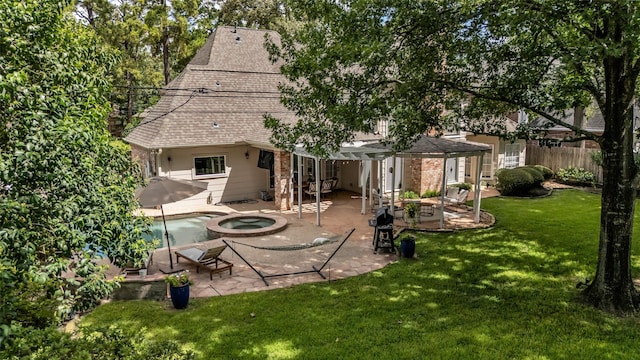 8723 Kennet Valley Rd, Spring, TX 77379 - rear view of property with a patio and roof with shingles