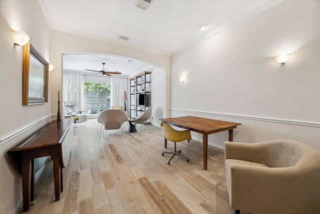 2019 Hazard St, Houston, TX 77019 - living area with light wood-style floors, arched walkways, crown molding, and a ceiling fan