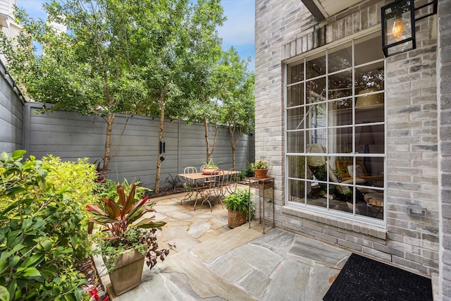 2019 Hazard St, Houston, TX 77019 - fenced backyard with a patio area and outdoor dining space