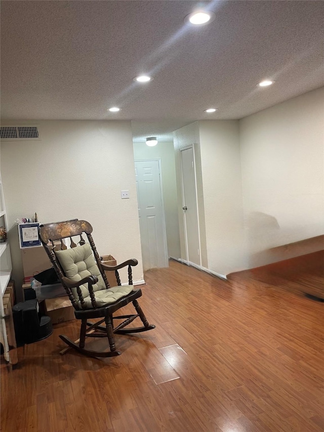 2120 El Paseo St Unit 2905, Houston, TX 77054 - living area featuring recessed lighting, wood finished floors, and a textured ceiling