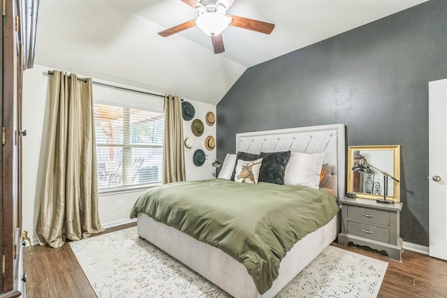 12602 Browning Dr, Montgomery, TX 77356 - bedroom with lofted ceiling, dark wood-type flooring, and a ceiling fan