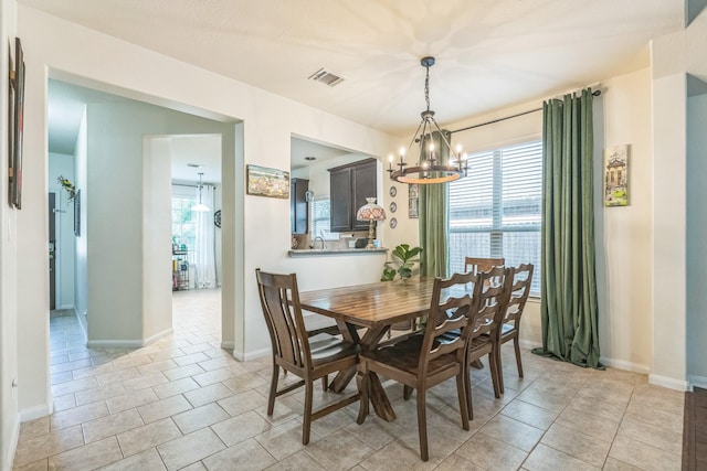 12602 Browning Dr, Montgomery, TX 77356 - dining room featuring a chandelier and light tile patterned floors