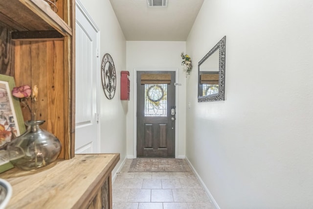 12602 Browning Dr, Montgomery, TX 77356 - entryway featuring baseboards and light tile patterned flooring