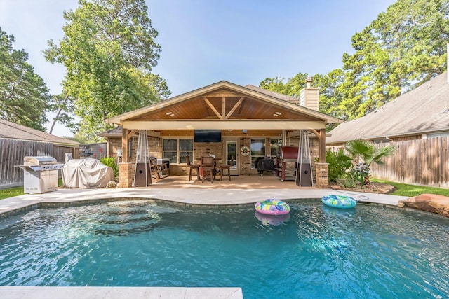 12602 Browning Dr, Montgomery, TX 77356 - view of pool featuring an outdoor kitchen, a fenced backyard, a patio, and an outdoor bar