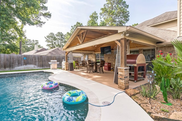 12602 Browning Dr, Montgomery, TX 77356 - view of swimming pool with a fenced backyard, a patio, and outdoor dining space