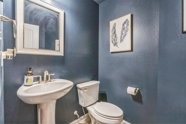 12602 Browning Dr, Montgomery, TX 77356 - half bathroom featuring toilet and baseboards
