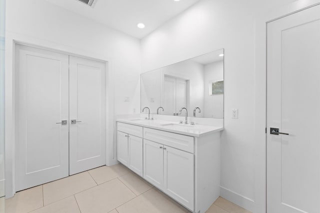 7722 Jacquelyn Oaks Rd, Houston, TX 77055 - full bath with double vanity, tile patterned floors, and recessed lighting