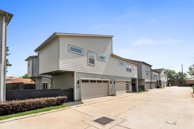 7722 Jacquelyn Oaks Rd, Houston, TX 77055 - view of home's exterior with an attached garage, driveway, and a residential view