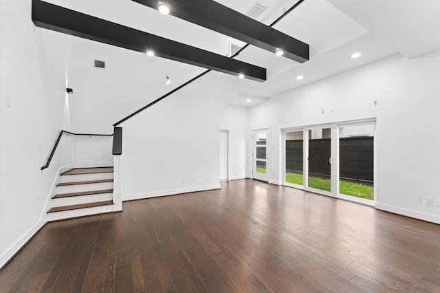 7722 Jacquelyn Oaks Rd, Houston, TX 77055 - unfurnished living room with wood finished floors, a towering ceiling, recessed lighting, and stairway