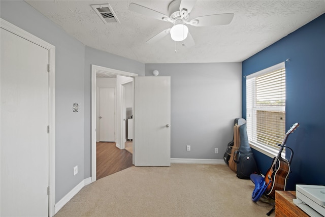 1111 Cypress Ln, Dayton, TX 77535 - recreation room featuring carpet, a ceiling fan, and a textured ceiling