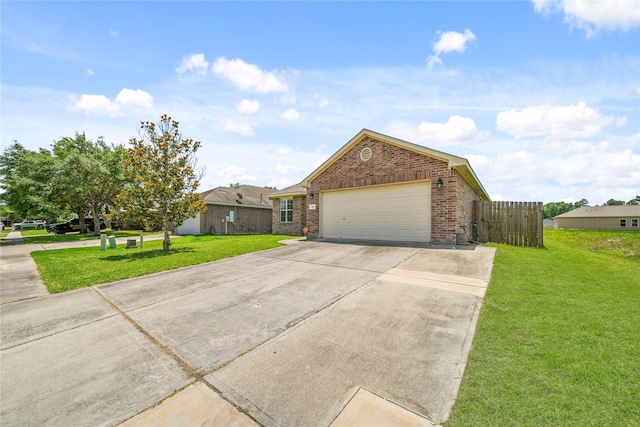1111 Cypress Ln, Dayton, TX 77535 - view of front of home with brick siding, driveway, and an attached garage