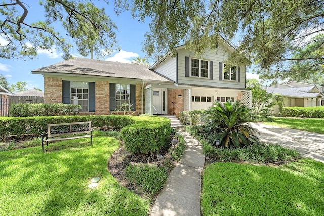 12239 Monticeto Ln, Meadows Place, TX 77477 - traditional home with driveway, brick siding, and a garage