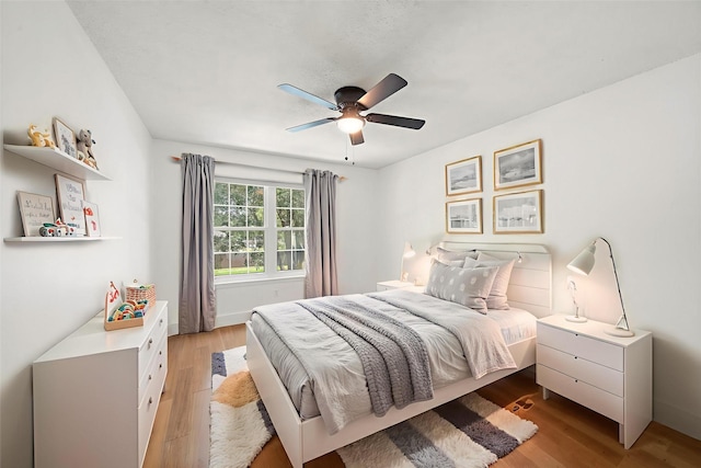 12239 Monticeto Ln, Meadows Place, TX 77477 - bedroom featuring light wood-style flooring and a ceiling fan
