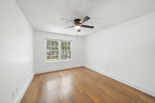12239 Monticeto Ln, Meadows Place, TX 77477 - spare room featuring a ceiling fan, wood finished floors, and a textured ceiling