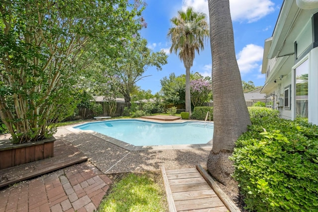 12239 Monticeto Ln, Meadows Place, TX 77477 - view of pool featuring a fenced backyard, a diving board, and a patio area