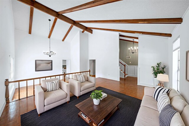 12239 Monticeto Ln, Meadows Place, TX 77477 - living room featuring a chandelier, stairway, a wainscoted wall, beam ceiling, and a decorative wall