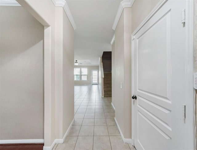 20015 Flax Flower Dr, Richmond, TX 77407 - hallway with light tile patterned flooring, ornamental molding, and stairs