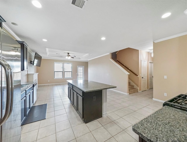 20015 Flax Flower Dr, Richmond, TX 77407 - kitchen with stainless steel fridge, crown molding, ceiling fan, light tile patterned flooring, and recessed lighting